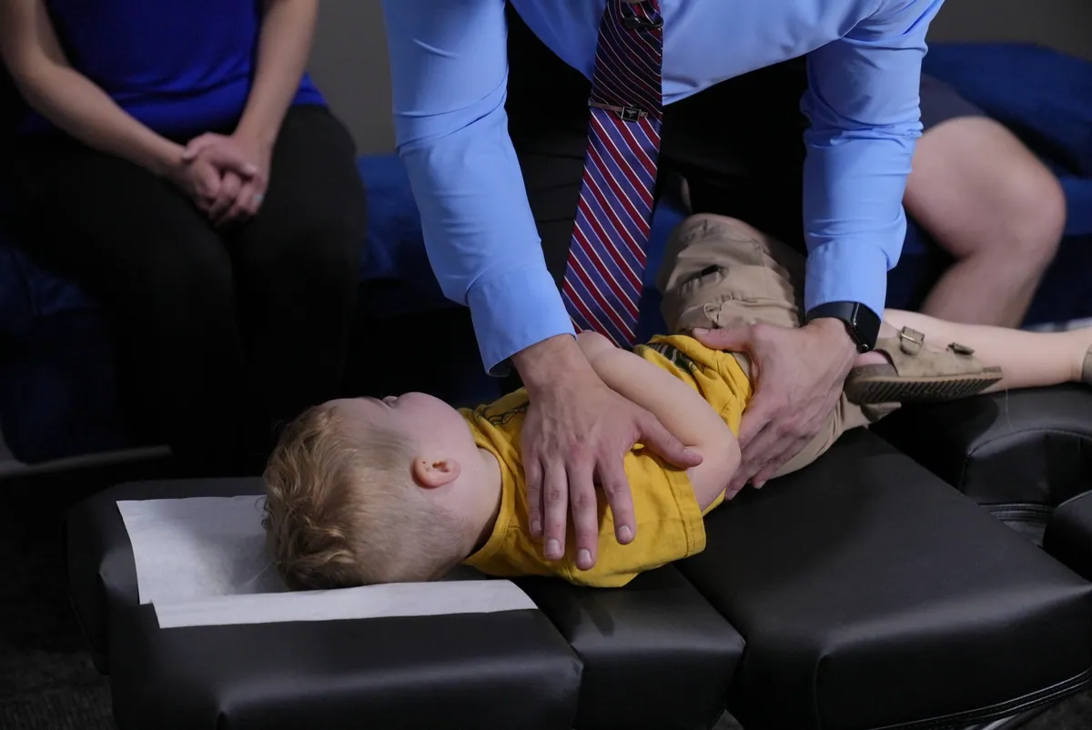 Gentle chiropractic adjustment for a young child