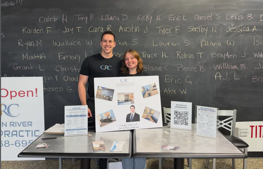 Dr. C.J. Levand and team at a community open house booth