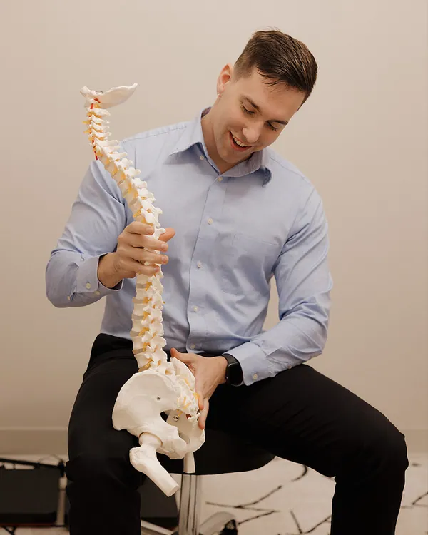 Dr. Charles J. Levand demonstrating on a spine model