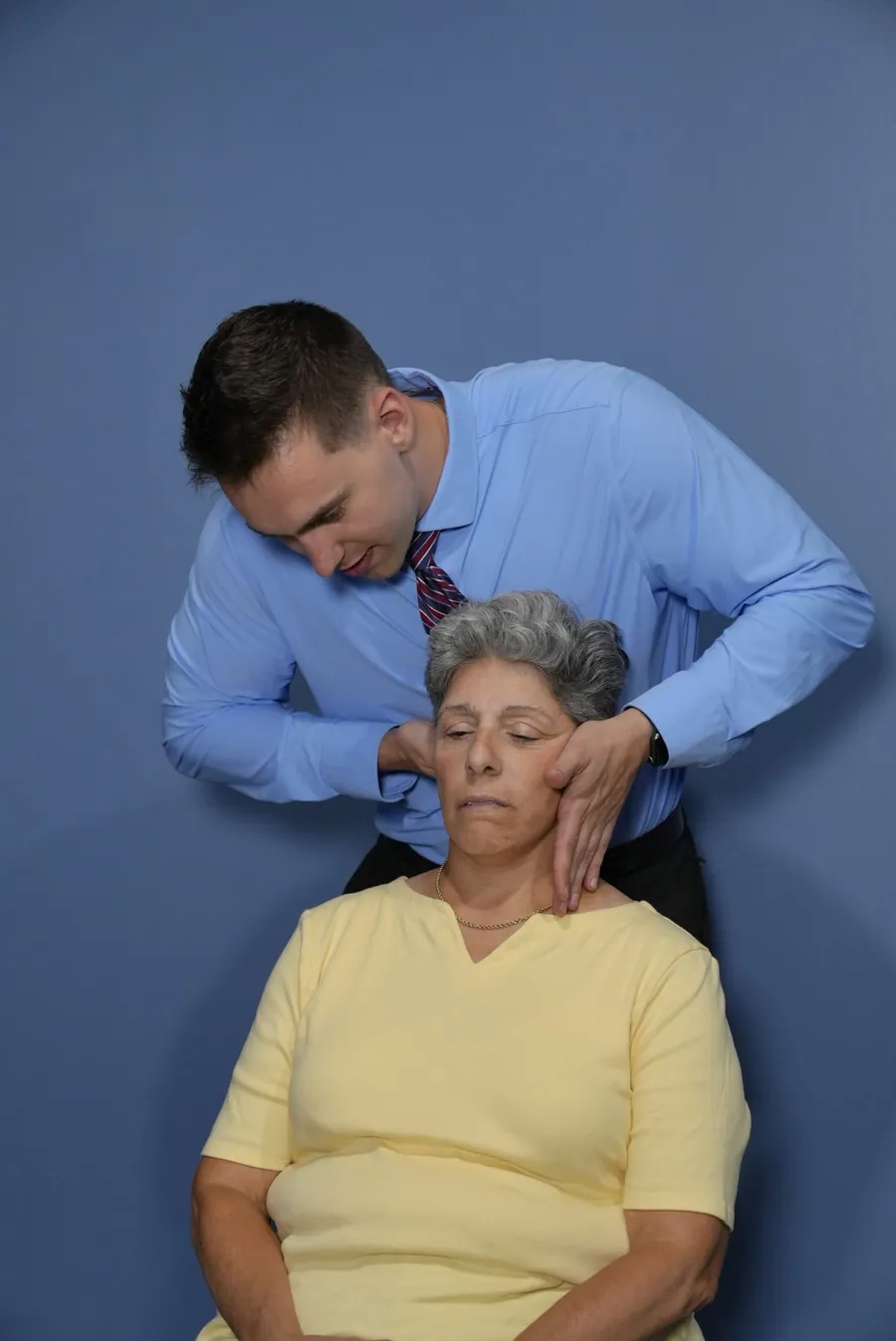 Dr. C.J. Levand performing a seated neck adjustment