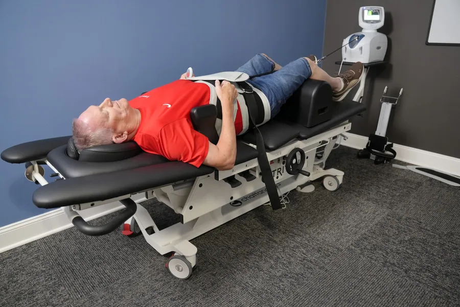 Patient on a spinal decompression table